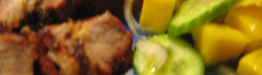 Sliced roast pork with cucumber and mango salad