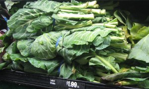Produce display of bunched collard greens