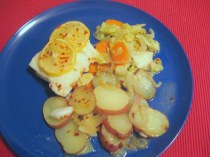 plated cod fillet with cabbage, carrots and potatoes