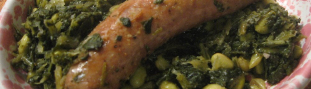 plate of greens, edamame, and a sausage